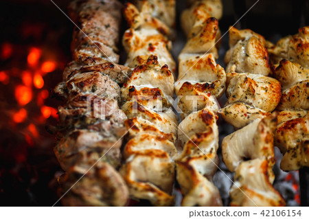 kebabs or bbq are roasted on the grill kebabs or bbq are roasted on the grill 42106154