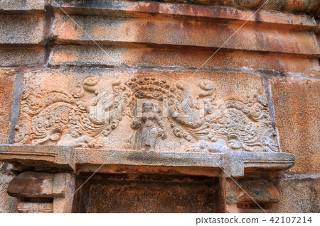 Makara and Yakshi figure carved on a wall Makara and Yakshi figure carved on a wall 42107214