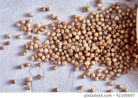 Coriander seeds isolated on white background, close-up, selective focus. Coriander seeds isolated on white background, close-up, selective focus. 42108697