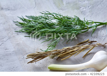 Mediterranean spice and herbs on white textured background, top view, close-up, selective focus. Mediterranean spice and herbs on white textured background, top view, close-up, selective focus. 42109223