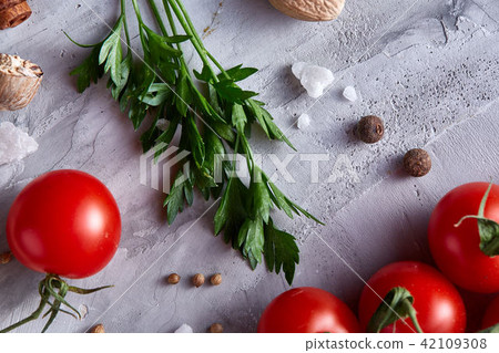 Cherry tomatoes, parsley and assorted spices on white textured background, flat lay, close-up 42109308