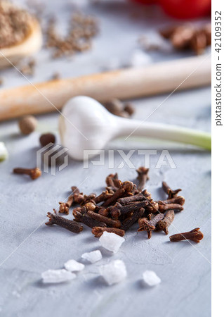 Culinary still life of assorted spices on white textured background, flat lay, close-up, shallow Culinary still life of assorted spices on white textured background, flat lay, close-up, shallow 42109352
