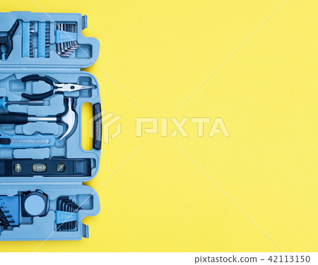Toolbox set of tools. Home improvement concept on yellow background. Toolbox set of tools. Home improvement concept on yellow background. 42113150
