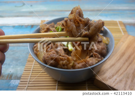 Cooked beef with rice on bowl 42113410