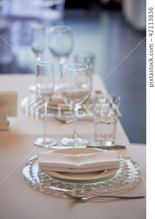 Classic table setting.White tablecloth, glasses, knife and fork. Ease 42113836