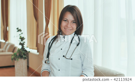 Portrait of a young female doctor in a good mood. Portrait of a young female doctor in a good mood. 42113924