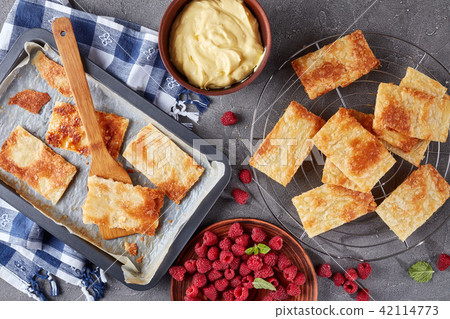 freshly baked portions of puff pastry 42114773