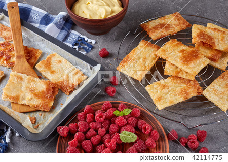 baked portions of puff pastry, close-up 42114775