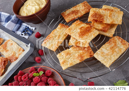 portions of puff pastry on a baking sheet 42114776