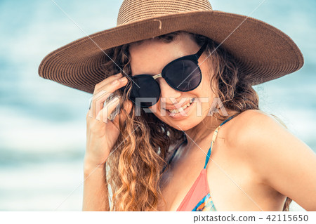 Happy young woman at beach in summer vacation. 42115650
