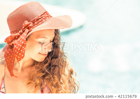 Happy young woman in swimsuit at swimming pool. Happy young woman in swimsuit at swimming pool. 42115679