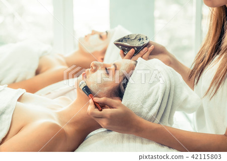 Beautiful woman having a facial treatment at spa. Beautiful woman having a facial treatment at spa. 42115803