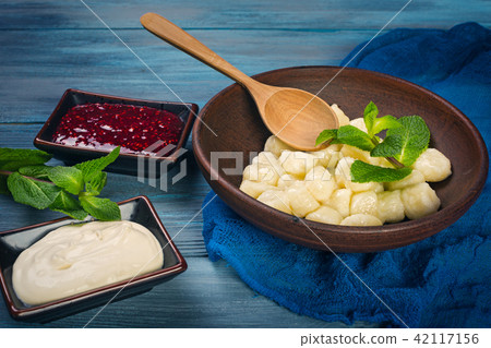 Lazy dumplings on blue background Lazy dumplings on blue background 42117156