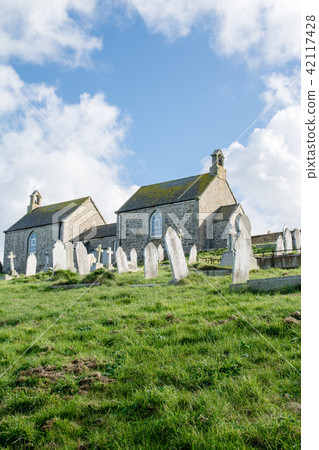 Cemetery in the outskirts of the United Kingdom Stone churches and tombstones Cemetery in the outskirts of the United Kingdom Stone churches and tombstones 42117428