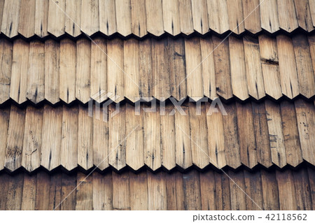 Old traditional wooden shingled roof background Old traditional wooden shingled roof background 42118562