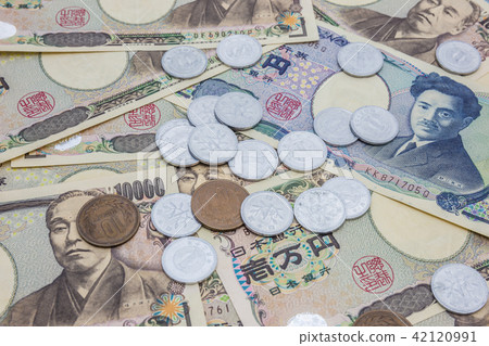 Closeup of Japanese yen banknotes and Japanese yen Closeup of Japanese yen banknotes and Japanese yen 42120991