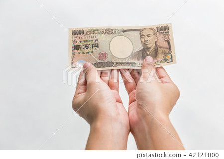 Businesswoman holding10,000 Japanese Yen money Businesswoman holding10,000 Japanese Yen money 42121000