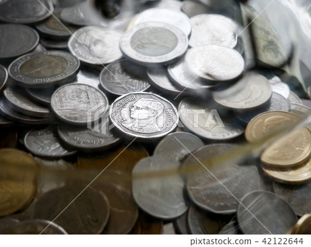 Thai coins in the saving glass bottle (piggy bank) Thai coins in the saving glass bottle (piggy bank) 42122644