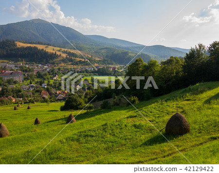 downhill from the mountain to the city overgrown w 42129422