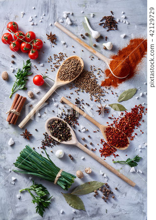 Culinary still life of assorted spices on white textured background, flat lay, close-up, selective Culinary still life of assorted spices on white textured background, flat lay, close-up, selective 42129729