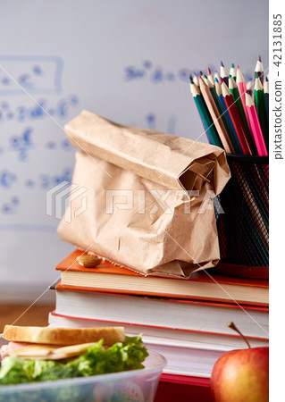 Preparing ham sandwiches for school lunchbox on wooden background, close up. Preparing ham sandwiches for school lunchbox on wooden background, close up. 42131885