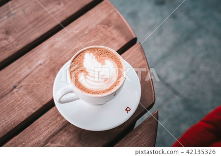 Specialty flat white coffee on a wooden table Specialty flat white coffee on a wooden table 42135326