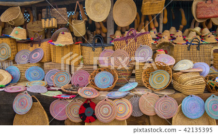 Craft wicker hats, bags and other souvenirs in Morocco market 42135395