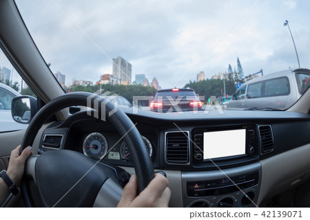 Driving car on city street 42139071