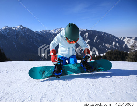 young woman snowboarder ready for snowboarding young woman snowboarder ready for snowboarding 42140806