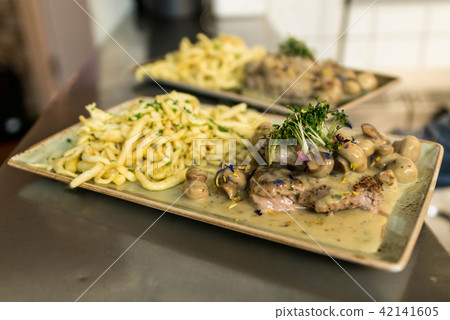 Spaetzle german baked gnocchi with chicken meat, champignons mushrooms asparagus and cheese Spaetzle german baked gnocchi with chicken meat, champignons mushrooms asparagus and cheese 42141605