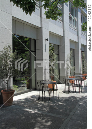 Tables and chairs, terrace with olive tree 42142182