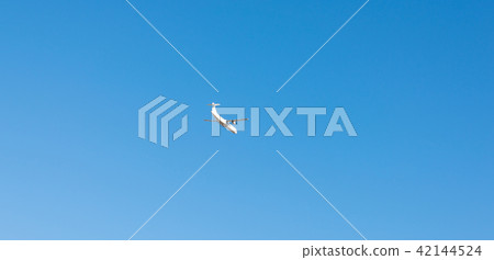 Passenger plane flying in the blue sky Passenger plane flying in the blue sky 42144524