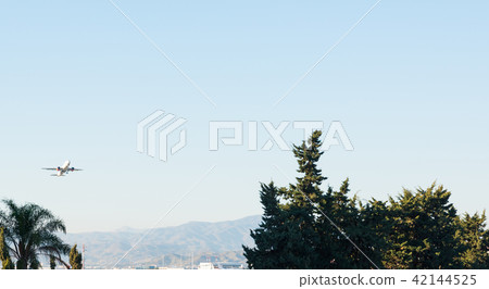Passenger plane flying in the blue sky Passenger plane flying in the blue sky 42144525
