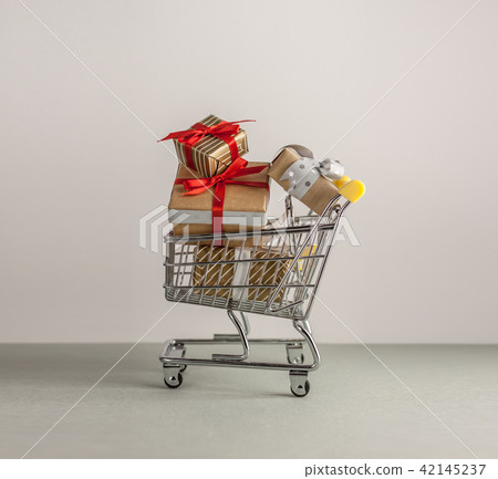 mini shopping cart with boxes with presents mini shopping cart with boxes with presents 42145237