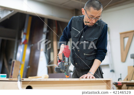 Factory craftsmen carpenters nail striking workers 42146529