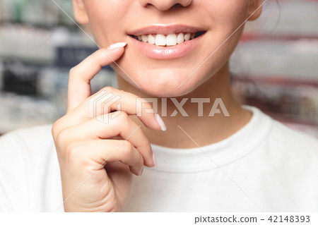 Lip Protection. Closeup of Beautiful Young Woman Lip Protection. Closeup of Beautiful Young Woman 42148393
