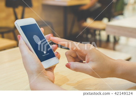 Hand women holding smartphone and scan fingerprint 42149124