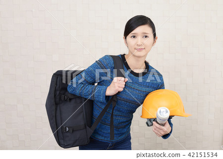 A woman holding a disaster prevention helmet and evacuating it A woman holding a disaster prevention helmet and evacuating it 42151534