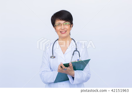 Medical doctor writing prescription over white background. 42151963