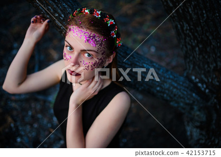 A young beautiful woman with a violet shine  42153715