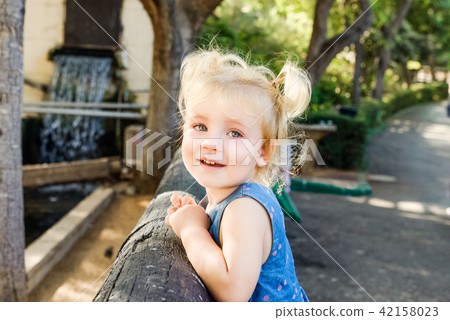 Portrait of little toddler Girl Smiling at Camera Portrait of little toddler Girl Smiling at Camera 42158023