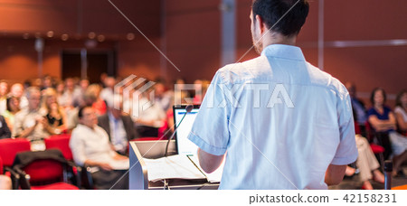 Public speaker giving talk at Business Event. Public speaker giving talk at Business Event. 42158231