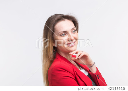 fashionable young woman posing in red suit 42158610