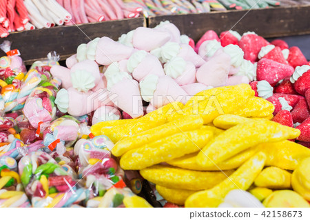 Assortment of fine chewy candy the most delicious of them banana Assortment of fine chewy candy the most delicious of them banana 42158673