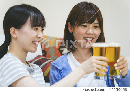 A woman drinking at home 42159468