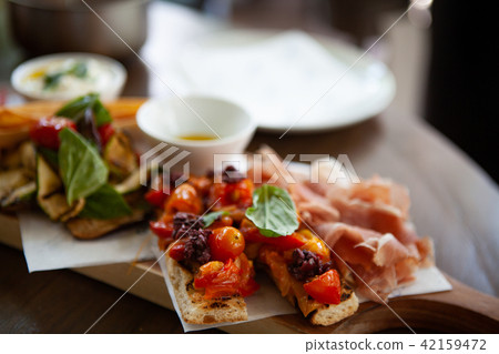 Delicious and colorful Italian Bruschetta. 42159472