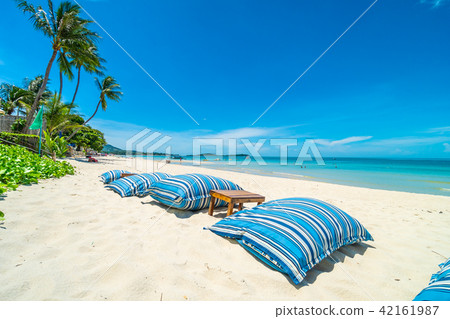 Beautiful tropical beach and sea with chair on blue sky 42161987