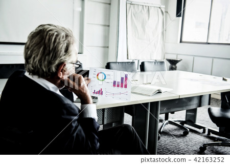 senior businessman working in office. senior businessman working in office. 42163252