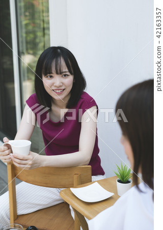A woman relaxing on the terrace 42163357