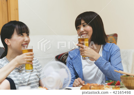 A woman drinking at home 42165498
